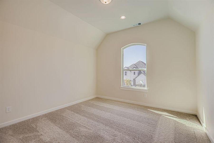 Additional living space with carpet flooring, lofted ceiling, and recessed lighting