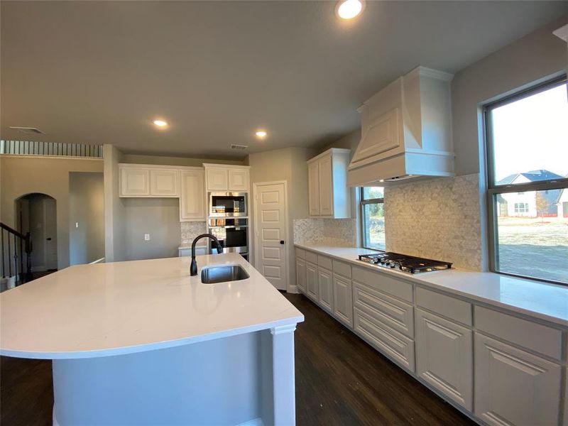 Kitche offers White cabinets, Marcella white with grey veins quartz & decorative mosaic tile backsplash