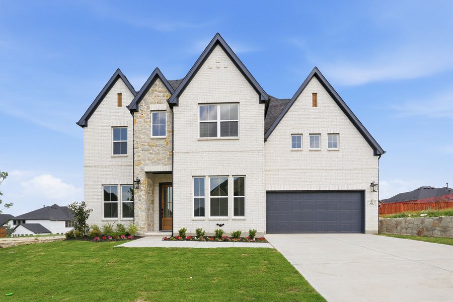 Front exterior of a new home in Hillside Village, Celina, TX, highlighting curb appeal (Image 2). Front exterior of a new home in Hillside Village, Celina, TX, highlighting curb appeal (Image 2).