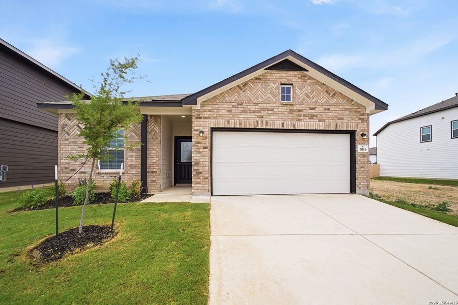 Front exterior of a new home in Hennersby Hollow, San Antonio, TX, highlighting curb appeal (Image 16). Front exterior of a new home in Hennersby Hollow, San Antonio, TX, highlighting curb appeal (Image 16).