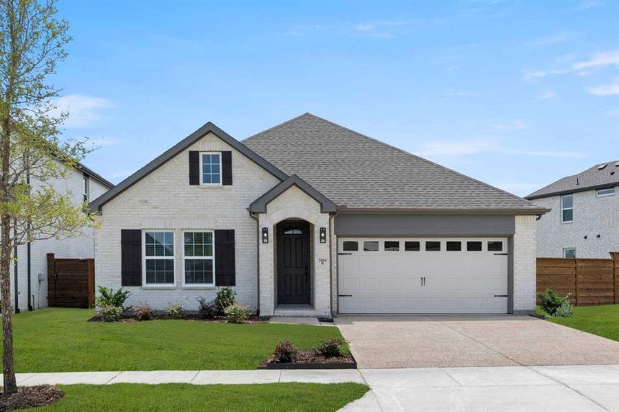 Front exterior of a new home in Solterra, Mesquite, TX, highlighting curb appeal (Image 26).
