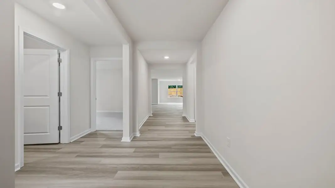Spacious, unfurnished interior of a new home in Bentley Park, Greenwood (Image 11).