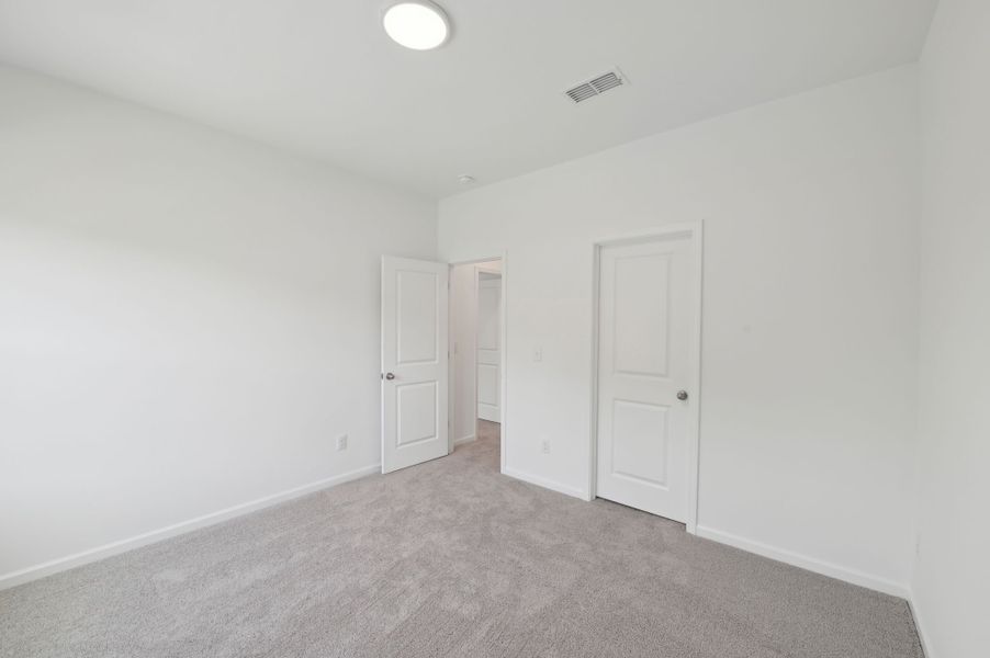 Representative unfurnished interior of a home built from the Jordan by Ashton Woods in Rowland's Grant, Fuquay Varina (Image 30).