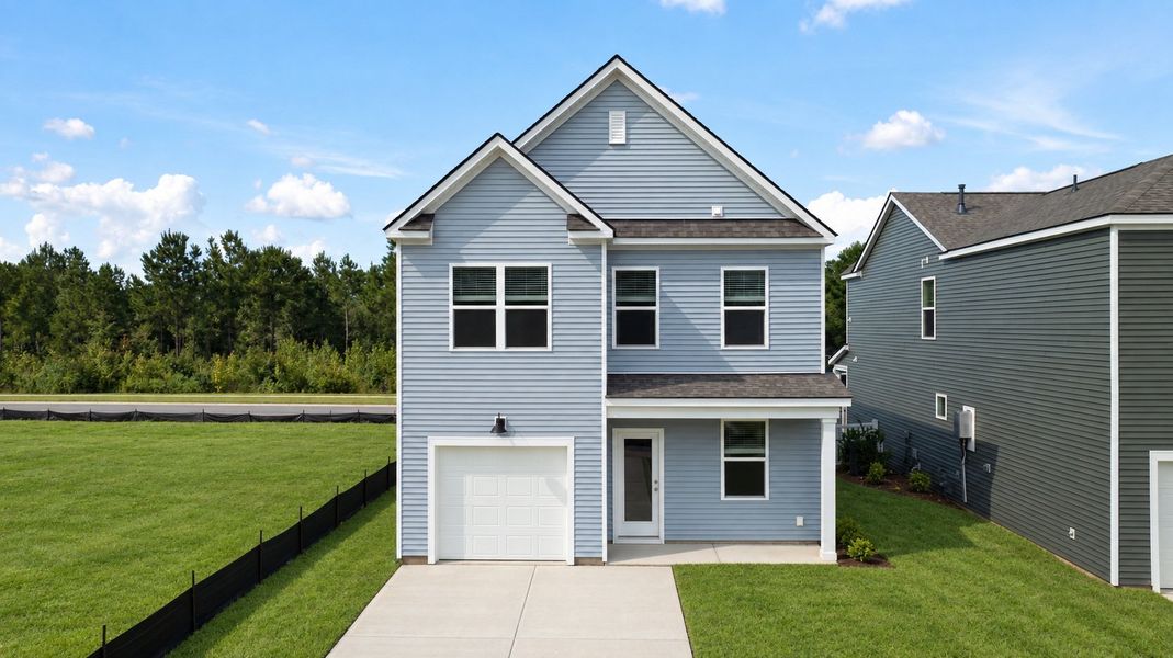 Front exterior of a new home in The Cove at Mallard Crossing, Summerville, SC, highlighting curb appeal (Image 2).