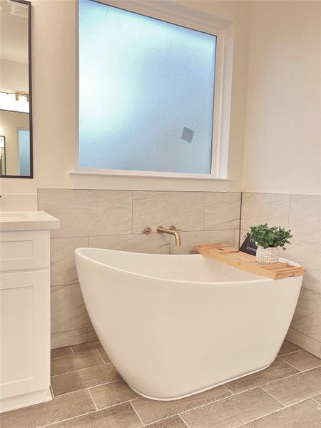 Luxurious soaking tub in master bathroom