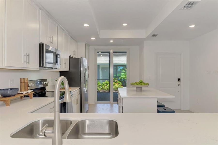 Furnished interior view inside a new home in Wellen Park Golf & Country Club, Venice (Image 9).