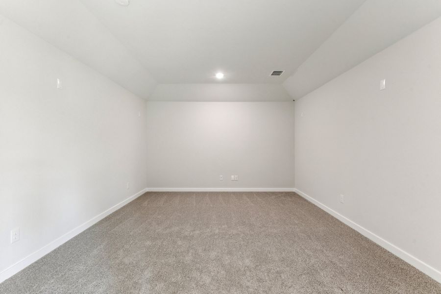 Media Room in the Wimbledon home plan by Trophy Signature Homes – REPRESENTATIVE PHOTO