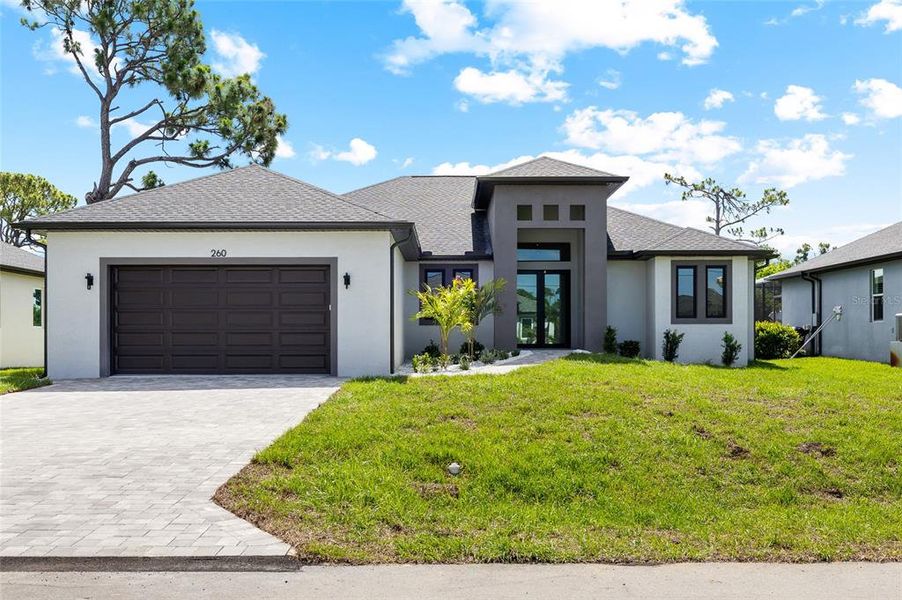 Front exterior of a new home in , Rotonda West, FL, highlighting curb appeal (Image 2). Front exterior of a new home in , Rotonda West, FL, highlighting curb appeal (Image 2).