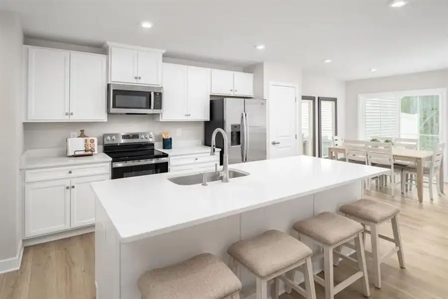 Representative furnished interior of a home built from the Nassau Cove - 3253 Edgehill Drive by Ryan Homes in Lakes at Riverbend, Navassa (Image 3).