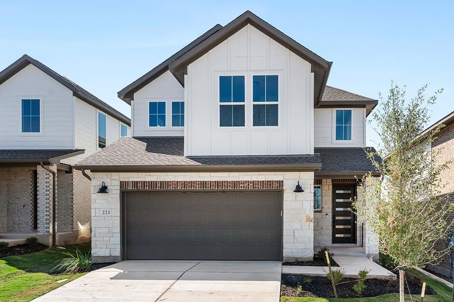 Front exterior of a new home in Terrace Collection at Lariat, Liberty Hill, TX, highlighting curb appeal (Image 1). Front exterior of a new home in Terrace Collection at Lariat, Liberty Hill, TX, highlighting curb appeal (Image 1).