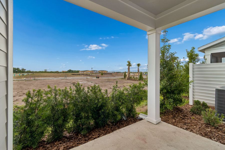 Exterior details and patio area of a home in Waterset Townhomes, Apollo Beach (Image 3).