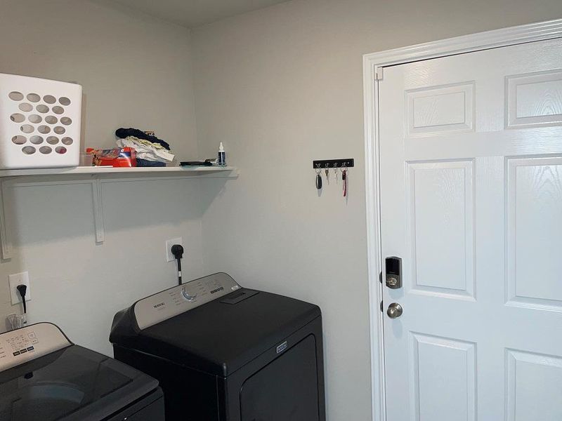 Washroom featuring independent washer and dryer