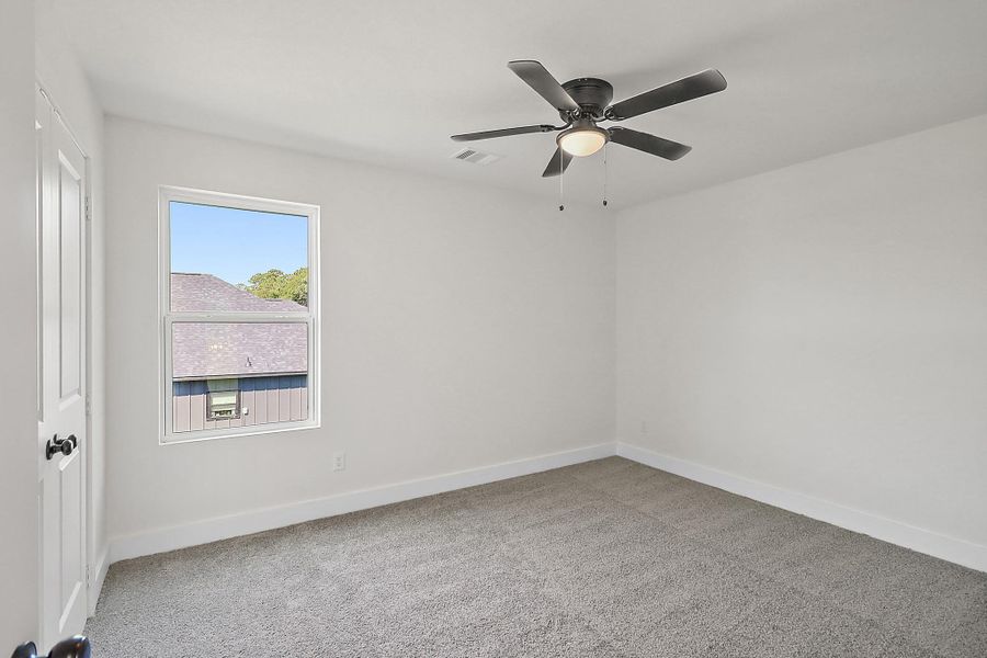One of the secondary bedrooms upstairs.
