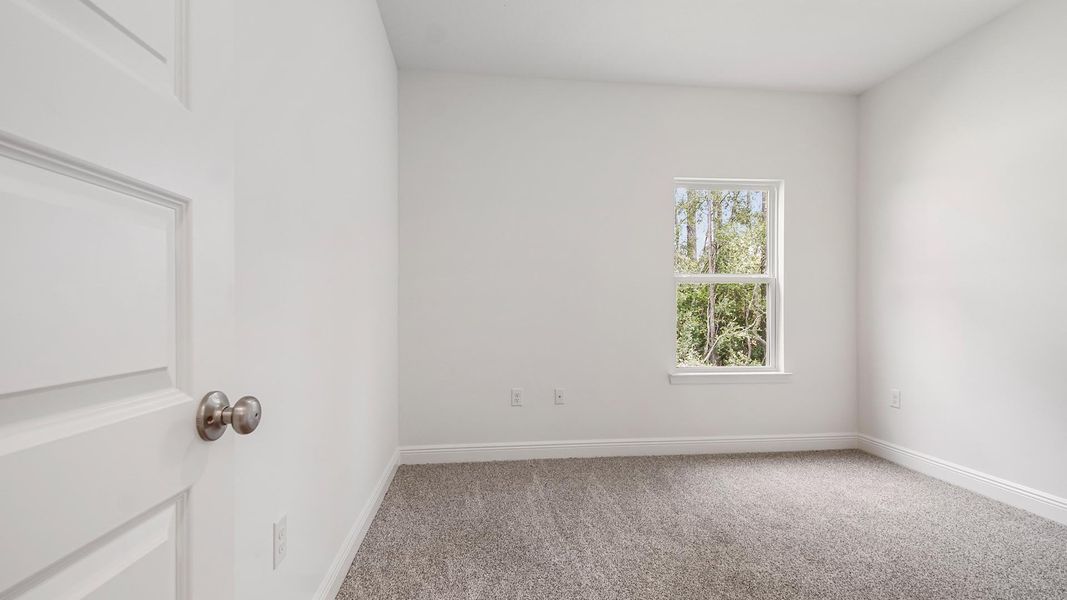 Representative unfurnished interior of a home built from the Carol by D.R. Horton in Holley Grove at Peach Creek, Santa Rosa Beach (Image 40).