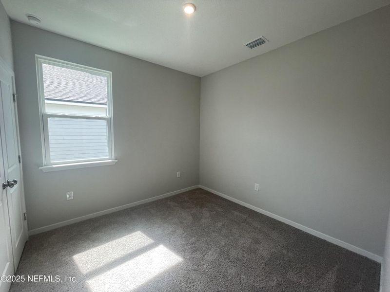 Spacious, unfurnished interior of a new home in Palm Series at Seminole Palms, Palm Coast (Image 30).