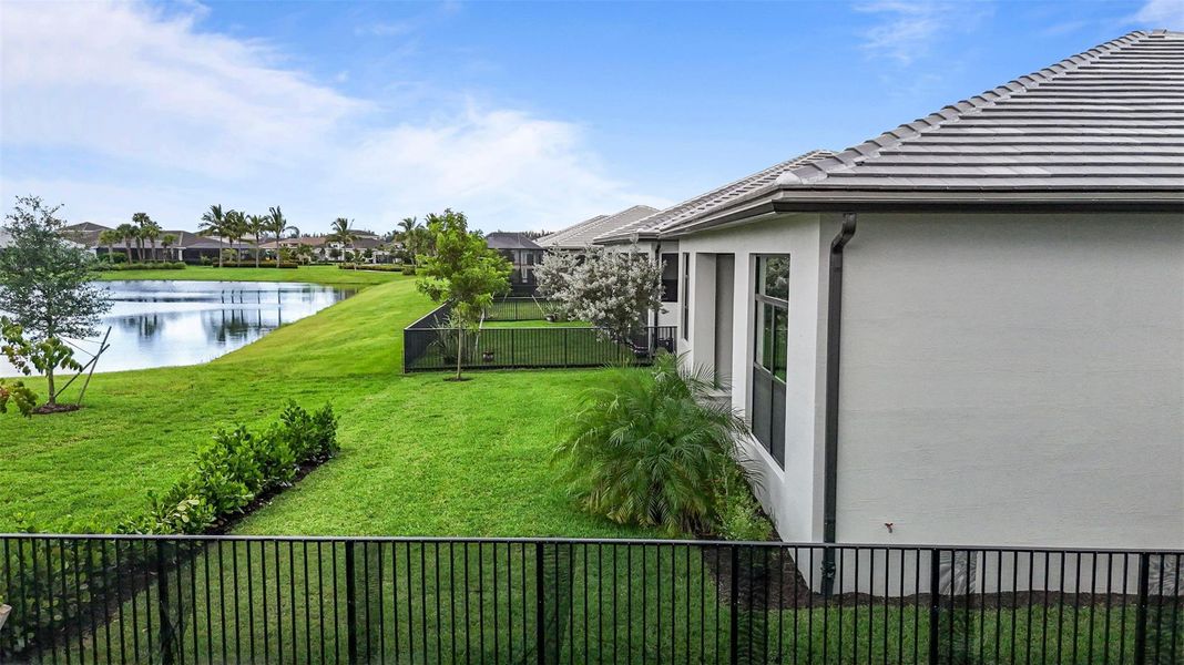 Exterior details and patio area of a home in Cresswind Palm Beach at Westlake, The Acreage (Image 29).