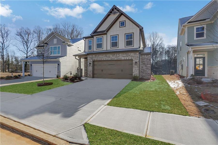 Front exterior of a new home in Villas at Dawsonville, Dawsonville, GA, highlighting curb appeal (Image 22).