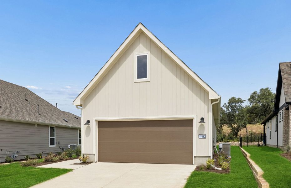 Front exterior of a new home in Sun City Texas, Georgetown, TX, highlighting curb appeal (Image 18). Front exterior of a new home in Sun City Texas, Georgetown, TX, highlighting curb appeal (Image 18).