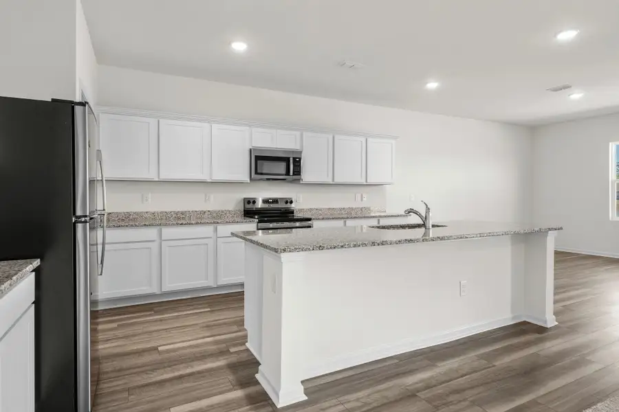 Representative furnished interior of a home built from the Europa by Starlight Homes in Oakfield Lakes, Parrish (Image 7).