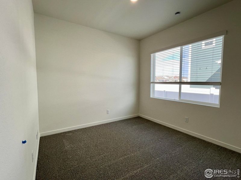 Spacious, unfurnished interior of a new home in Union Colony West, Greeley (Image 16).