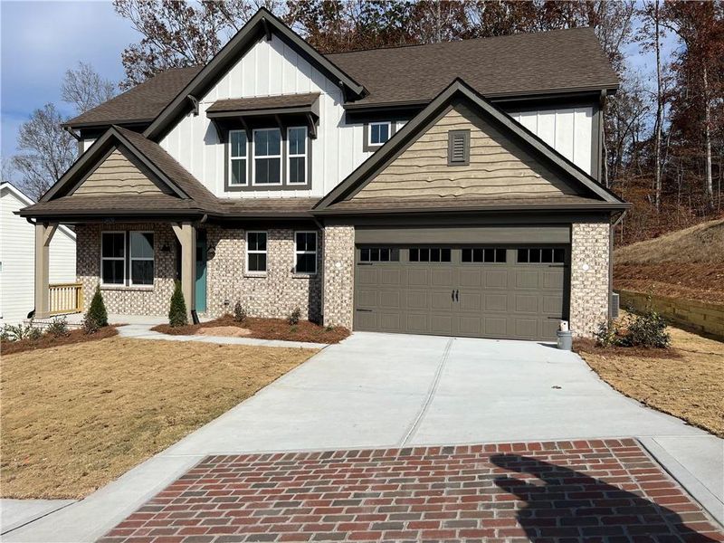 Front exterior of a new home in , Ball Ground, GA, highlighting curb appeal (Image 1). Front exterior of a new home in , Ball Ground, GA, highlighting curb appeal (Image 1).