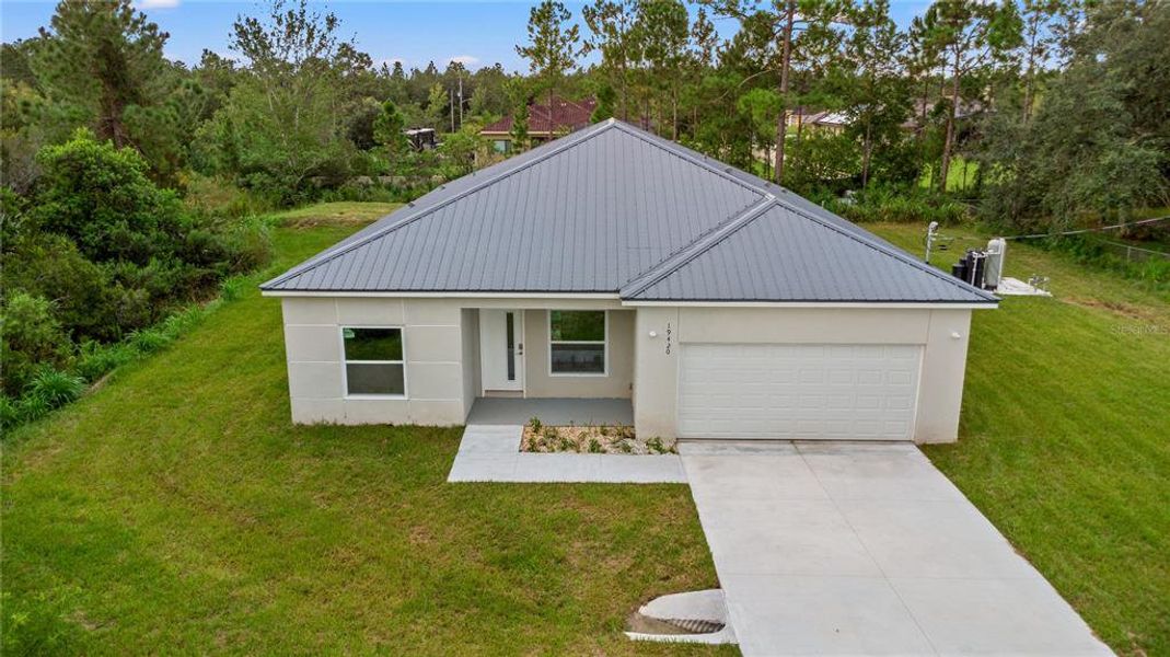 Front exterior of a new home in , Orlando, FL, highlighting curb appeal (Image 1). Front exterior of a new home in , Orlando, FL, highlighting curb appeal (Image 1).