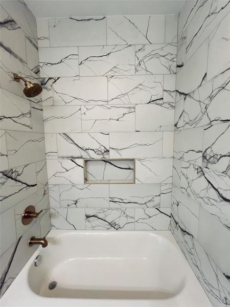 Bathroom featuring tub / shower combination Bathroom featuring tub / shower combination