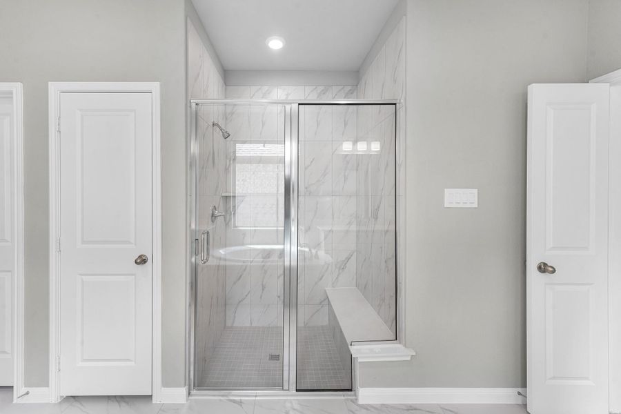 View of the separate shower in the primary bathroom.