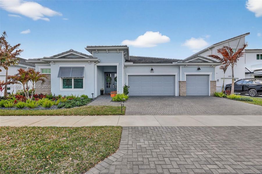Front exterior of a new home in , Port St. Lucie, FL, highlighting curb appeal (Image 24).