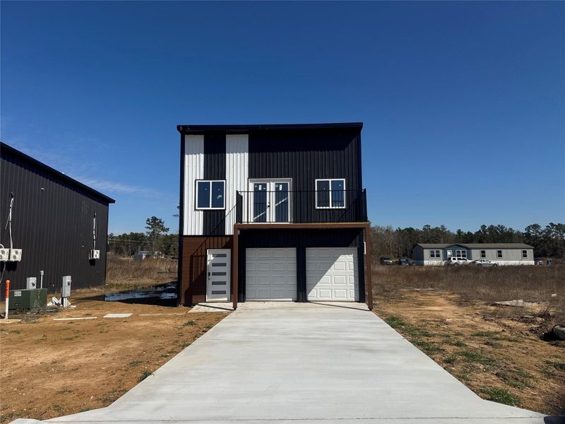 Front exterior of a new home in , Cleveland, TX, highlighting curb appeal (Image 4). Front exterior of a new home in , Cleveland, TX, highlighting curb appeal (Image 4).