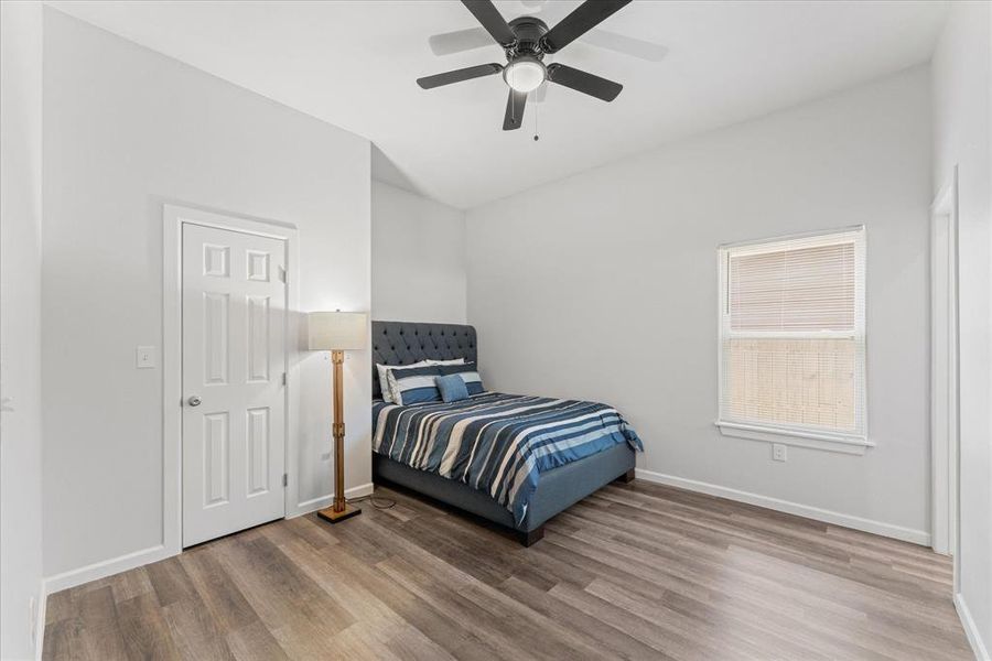 Bedroom featuring light wood-style floors and ceiling fan
