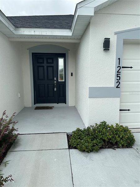 Front exterior of a new home in , Auburndale, FL, highlighting curb appeal (Image 1). Front exterior of a new home in , Auburndale, FL, highlighting curb appeal (Image 1).