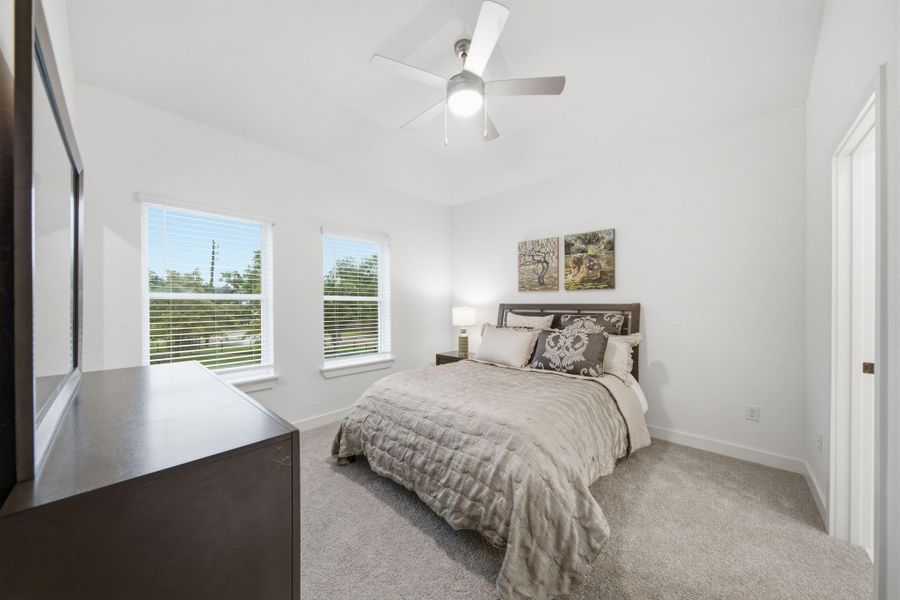 Primary bedroom with private treetop views. Can accommodate a king-sized bed. Primary bedroom with private treetop views. Can accommodate a king-sized bed.