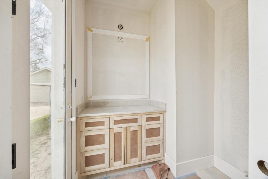 Designed with convenience and style in mind, the pool bath offers easy exterior access while maintaining a cohesive aesthetic with the rest of the home. Clean lines, durable finishes, and thoughtful layout make this space ideal for guests transitioning from outdoor entertaining to indoor comfort. Designed with convenience and style in mind, the pool bath offers easy exterior access while maintaining a cohesive aesthetic with the rest of the home. Clean lines, durable finishes, and thoughtful layout make this space ideal for guests transitioning from outdoor entertaining to indoor comfort.