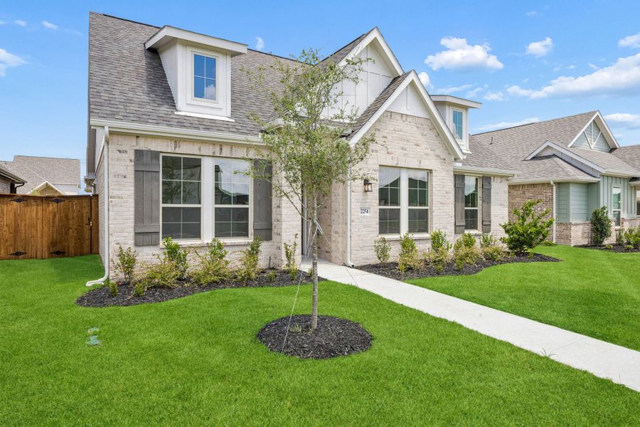 Front exterior of a new home in Dove Hollow, Waxahachie, TX, highlighting curb appeal (Image 2). Front exterior of a new home in Dove Hollow, Waxahachie, TX, highlighting curb appeal (Image 2).