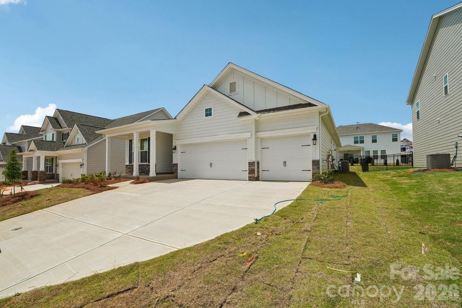 Front exterior of a new home in Sylvan Creek, Denver, NC, highlighting curb appeal (Image 25). Front exterior of a new home in Sylvan Creek, Denver, NC, highlighting curb appeal (Image 25).