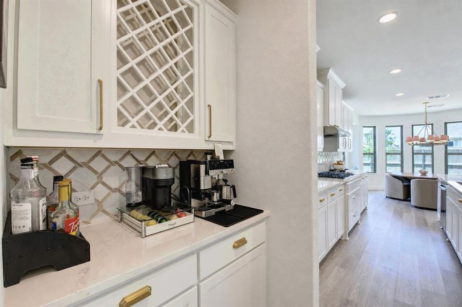 A butler's pantry, which makes an excellent coffee bar, connects the dining room and kitchen.