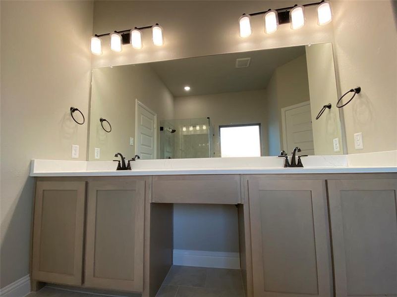 Spacious dual sinks in quartz master bath vanity Spacious dual sinks in quartz master bath vanity