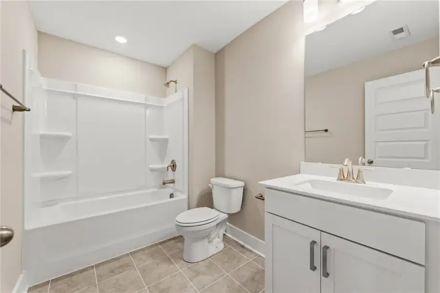 A well-appointed bathroom offers a clean vanity, b A well-appointed bathroom offers a clean vanity, b