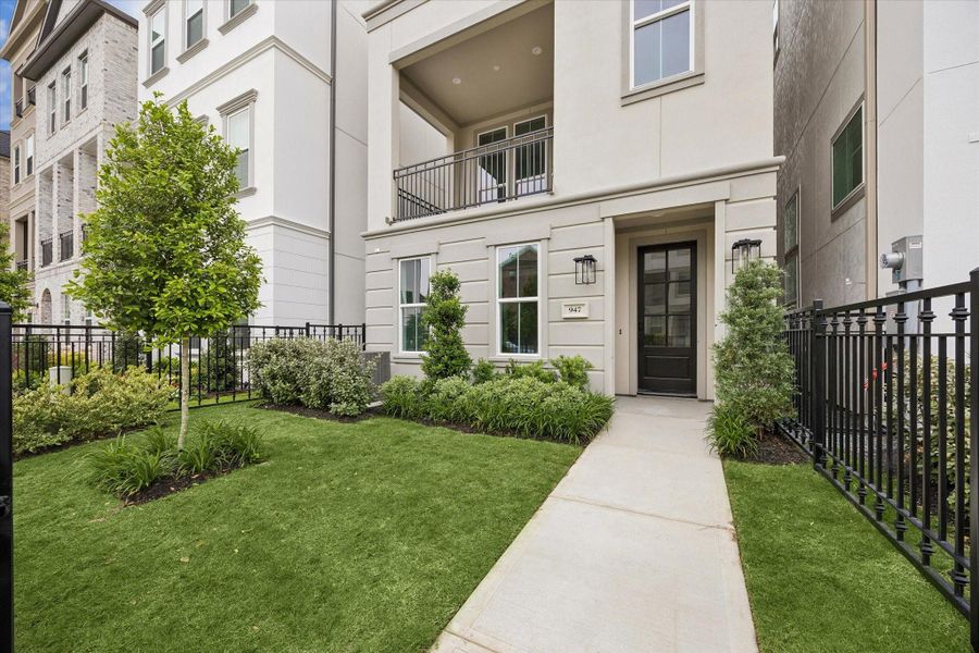 Expansive front green space offering a lush, welcoming setting with plenty of room to enjoy the outdoors.