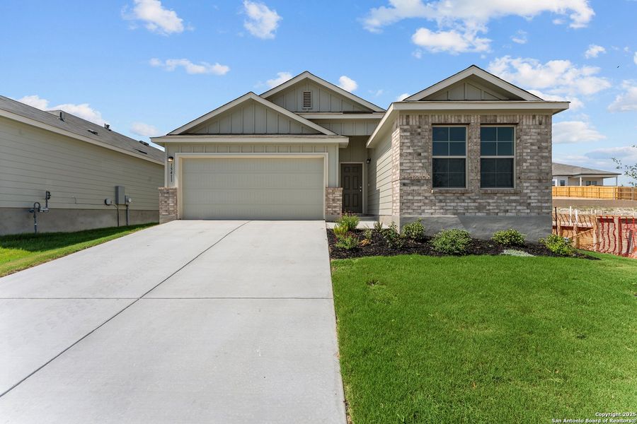 Front exterior of a new home in Hunters Ranch, San Antonio, TX, highlighting curb appeal (Image 12). Front exterior of a new home in Hunters Ranch, San Antonio, TX, highlighting curb appeal (Image 12).
