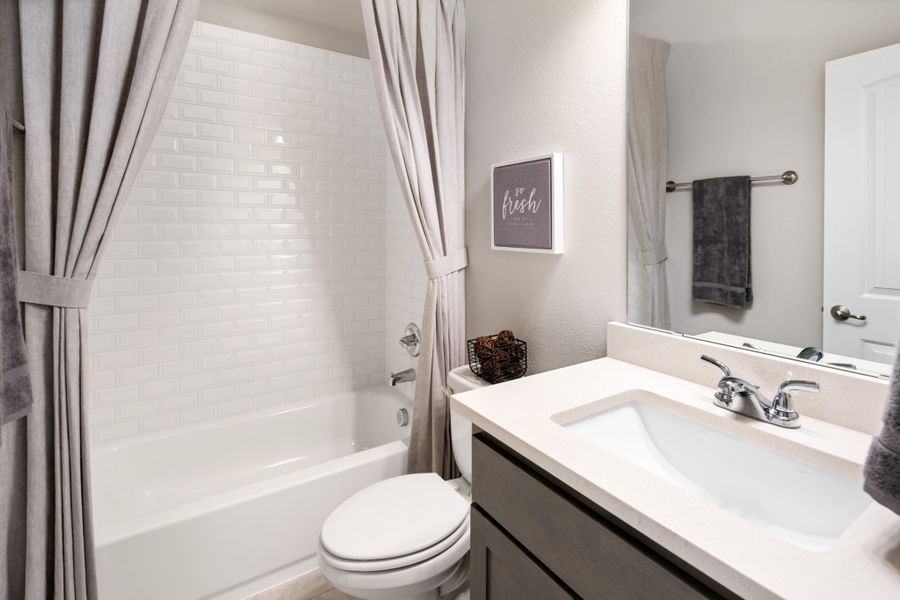 Representative furnished interior of a home built from the Brazos by UnionMain Homes in Wildflower Ranch, Justin (Image 28).