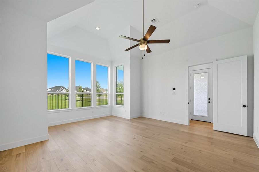 Unfurnished living room featuring light wood-style flooring, a ceiling fan, and recessed lighting Unfurnished living room featuring light wood-style flooring, a ceiling fan, and recessed lighting