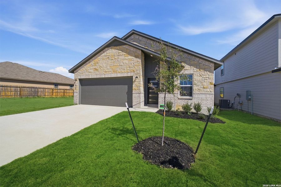 Front exterior of a new home in Laurel Vistas, San Antonio, TX, highlighting curb appeal (Image 18). Front exterior of a new home in Laurel Vistas, San Antonio, TX, highlighting curb appeal (Image 18).