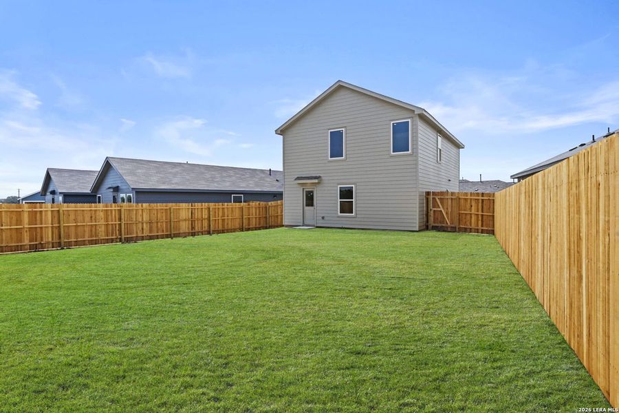 Exterior details and patio area of a home in Spring Grove, St. Hedwig (Image 15).