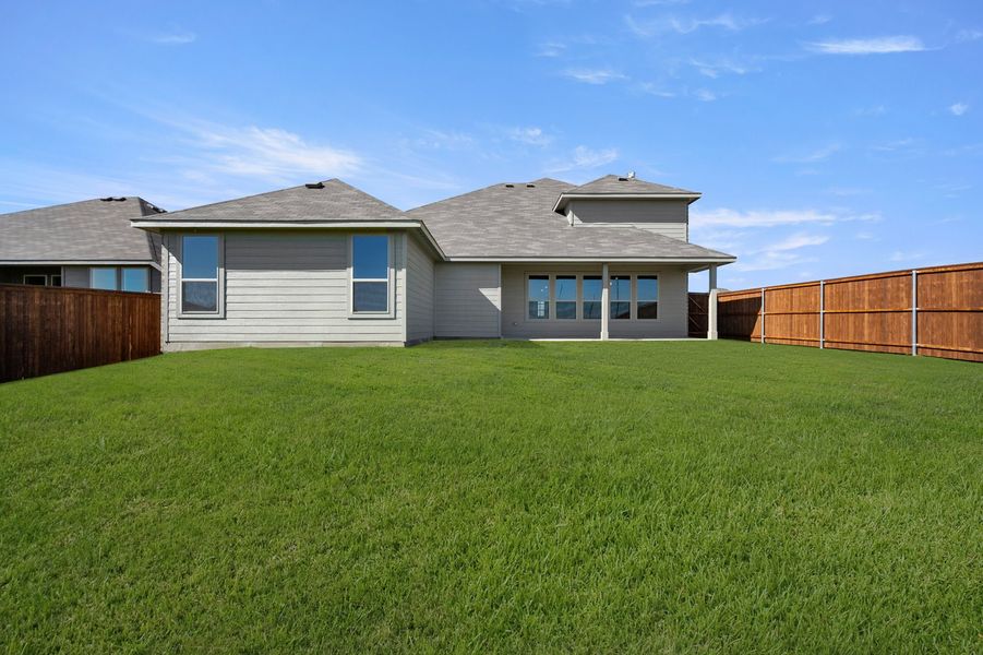 Front exterior of a new home in Still Water Lake Estates, Godley, TX, highlighting curb appeal (Image 28). Front exterior of a new home in Still Water Lake Estates, Godley, TX, highlighting curb appeal (Image 28).