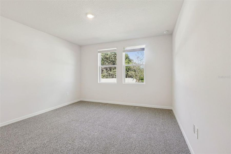 Spacious, unfurnished interior of a new home in Bradbury Creek - Signature Series, Haines City (Image 29).