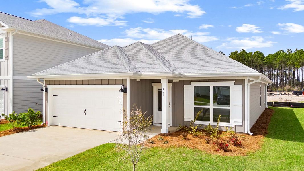 Front exterior of a new home in Bayside at Ward Creek, Panama City Beach, FL, highlighting curb appeal (Image 2). Front exterior of a new home in Bayside at Ward Creek, Panama City Beach, FL, highlighting curb appeal (Image 2).