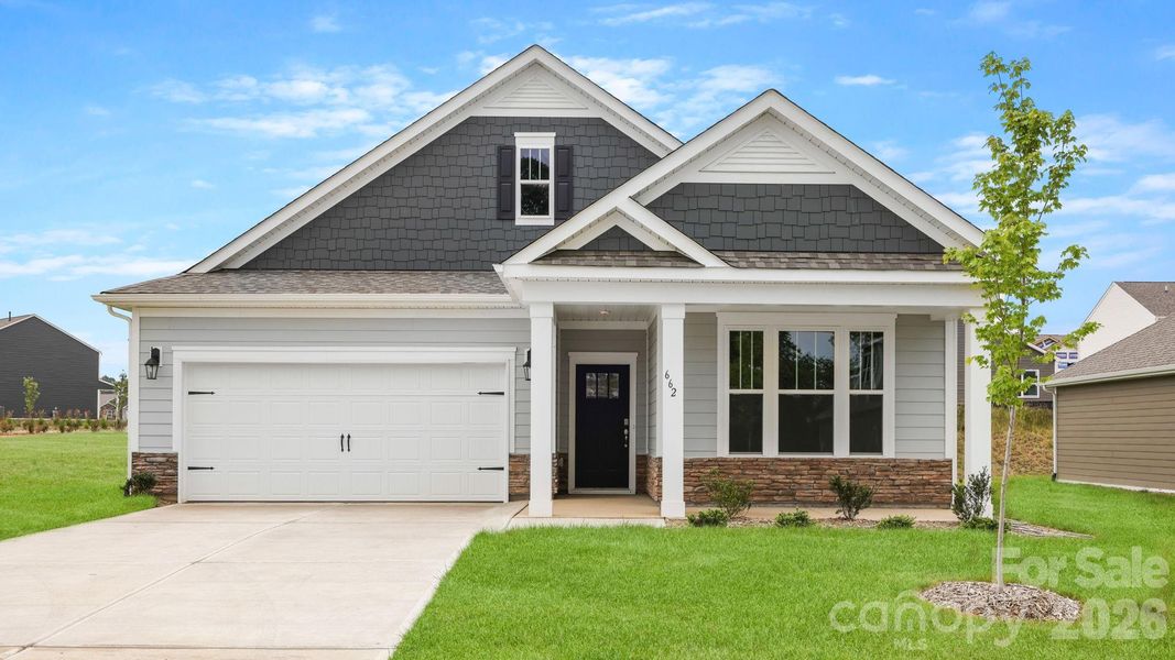 Front exterior of a new home in Tap Root Farms, Fletcher, NC, highlighting curb appeal (Image 2). Front exterior of a new home in Tap Root Farms, Fletcher, NC, highlighting curb appeal (Image 2).