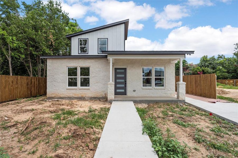 View of front of house with board and batten siding View of front of house with board and batten siding